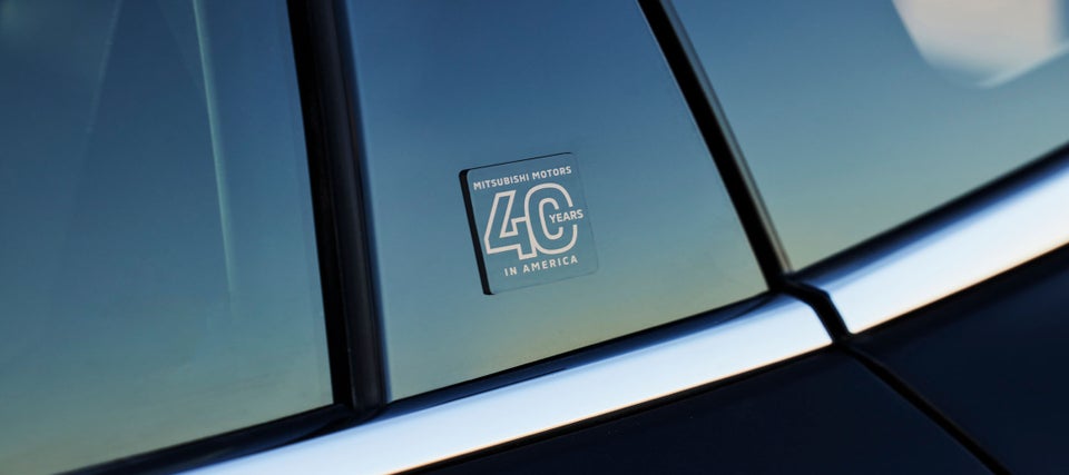 2023 Mitsubishi Motors 40 Years in America logo on window